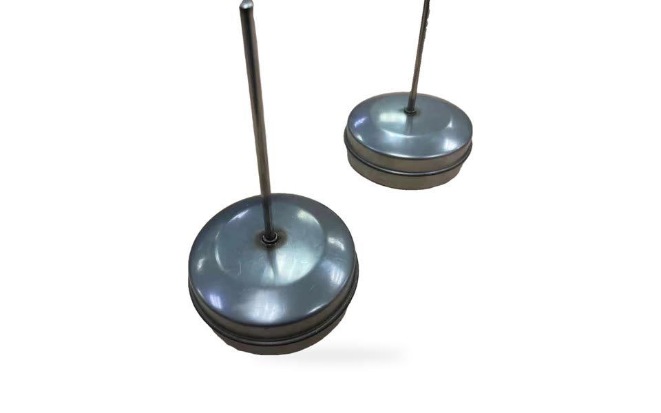 Stainless steel floats with rods attached, made by us