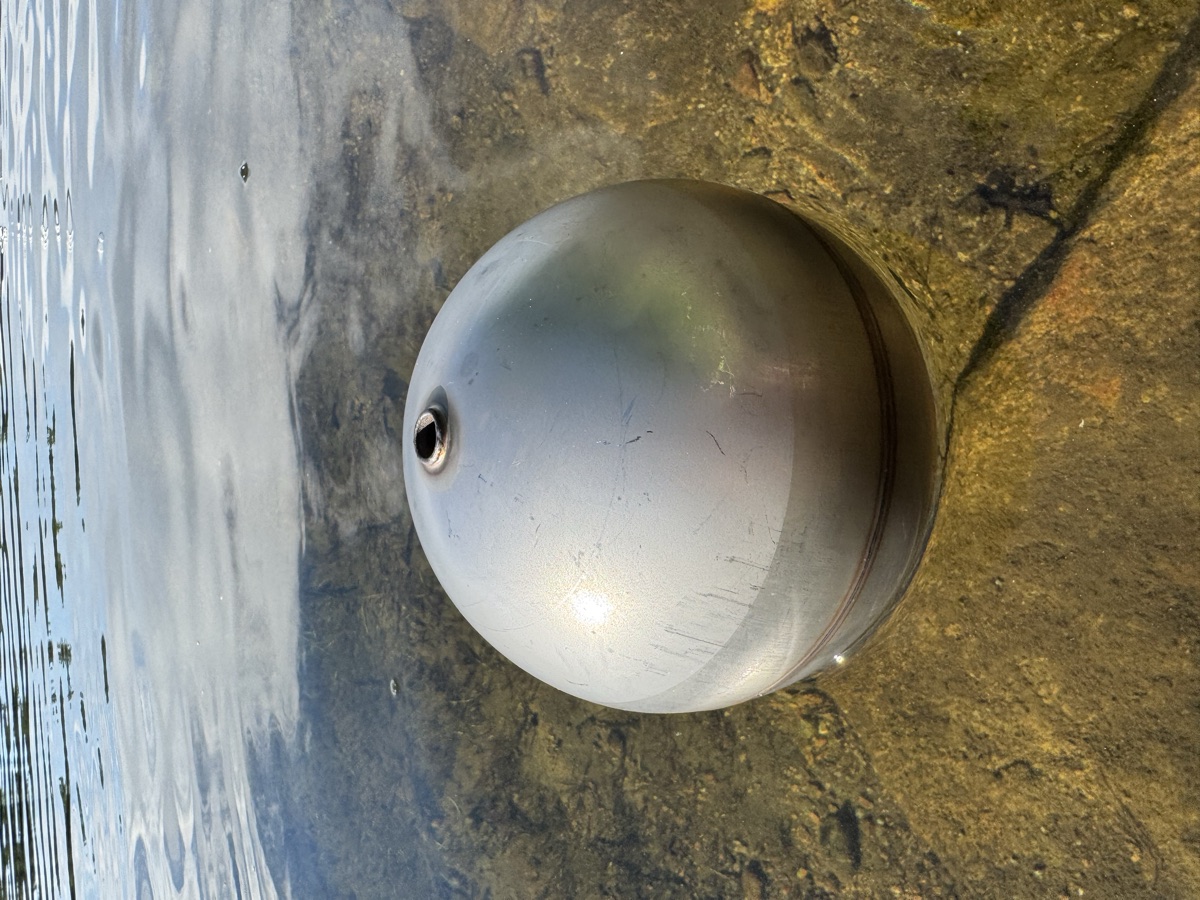 Sealed stainless steel float ball floating on the surface of the water
